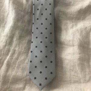 Brown and white polka dot tie